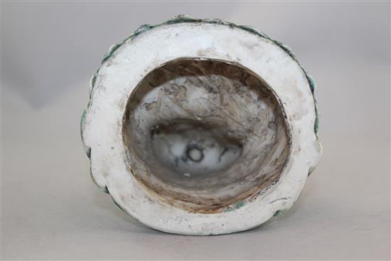 A Chinese green glazed biscuit porcelain seated figure of Guanyin, 12cm